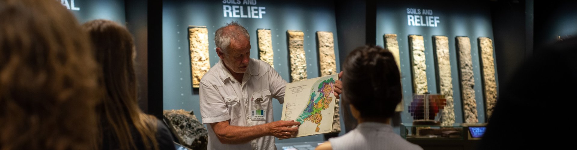 Scientist pointing at map of the Netherlands