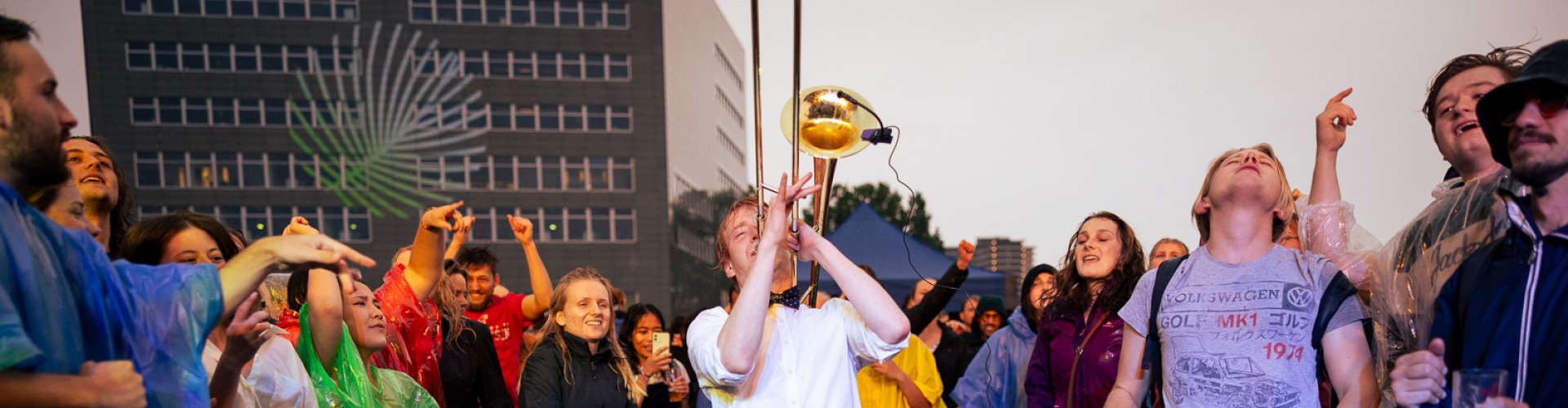Someone playing trombone at a festival