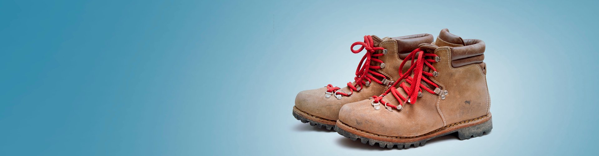 Bergschoenen op blauwe achtergrond